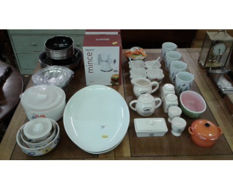 A quantity of kitchenalia to include enamel plates and bowls; two as new mincers; a quantity of vintage home china etc. 