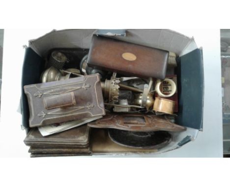A box of mixed items to include a leather desk blotter; serviette rings; a Great Western Railway brass lamp etc.