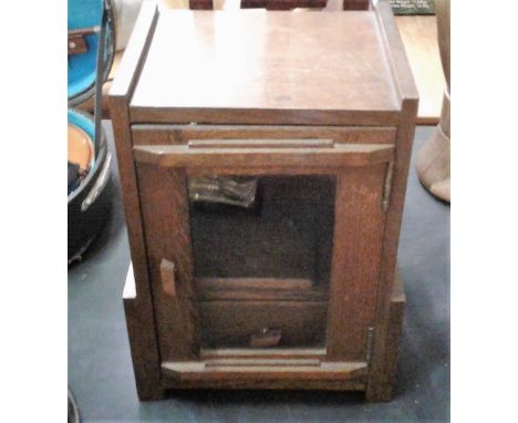 An Art Deco oak smoker's cabinet