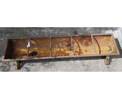 Cast metal feeding trough