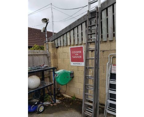 Large extending aluminium ladder along with large wooden extending ladder