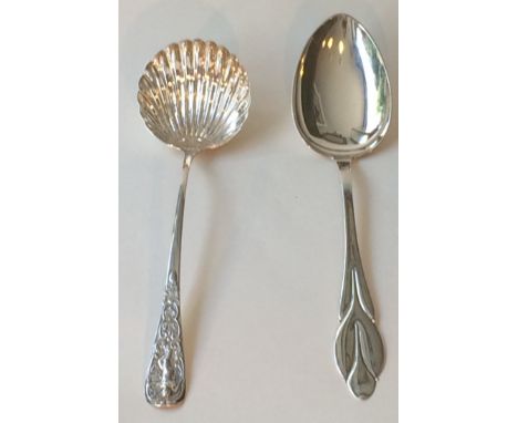 A Georgian silver punch ladle with cherub and scalloped detailing with inscription ‘Sub Cruce Salus’ above stork L33.5cm.  To