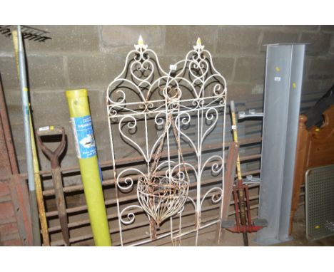 Two metal garden stakes with a hanging planter