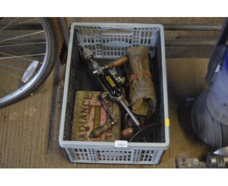 A box of various tools; including a Stanley hand drill