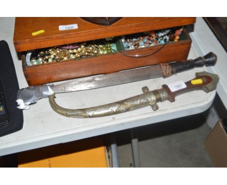 A Middle Eastern dagger and scabbard together with one other