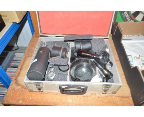 An aluminium case of various camera lens etc