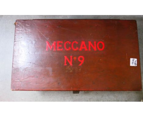 Meccano - A large wooden home made storage case (measuring 70cm x 40cm x 23cm) containing an assortment of Meccano pieces wit