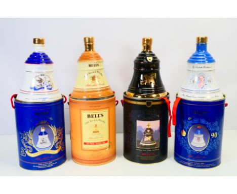 Bell's Whisky -  Four decanters of Bell's whisky. Ceramic bell shaped, sealed with contents and stored inside cylindrical tin