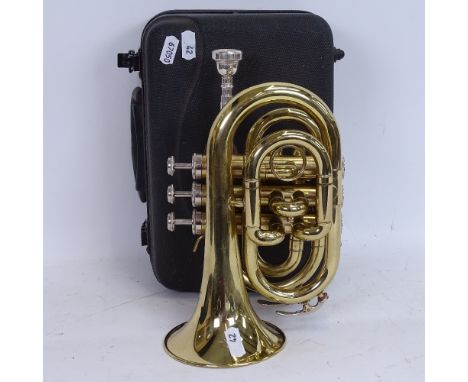 A Stagg 77-MT gold lacquered 3-valve pocket trumpet, serial no. 3419, length 24cm, in original Stagg fitted hardshell carryin