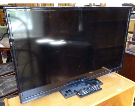 A Bush 32" flat screen TV with remote, GWO 
