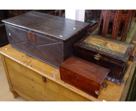 An 18th century joined oak Bible box, with carved front, W74cm, a Georgian mahogany tea caddy, and a painted tin box 