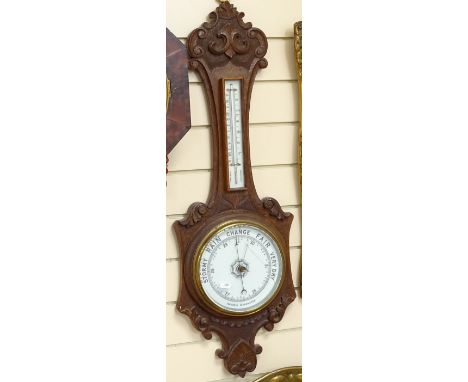 An oak-cased wall hanging wheel barometer and thermometer, case height 88cm 