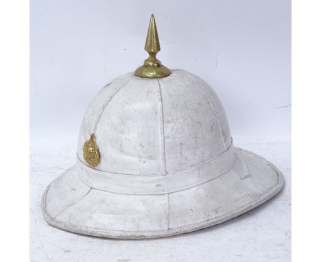 A Royal Marine Corps of Drums white pith helmet and badge 