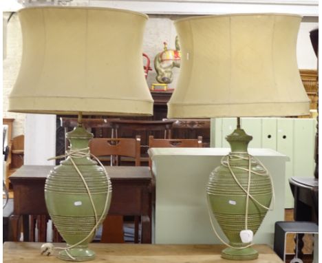 A pair of Italian green glazed ceramic baluster shaped table lamps and shades, height to top of shade 92cm 