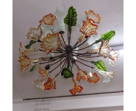 A large and impressive multi-arm coloured glass shaded chandelier 