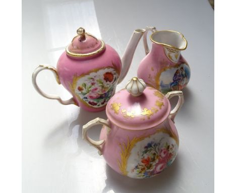 A Sevres teapot with painted floral and cherub panels, height 13cm, a Sevres cream jug and sucrier with panels decorated with