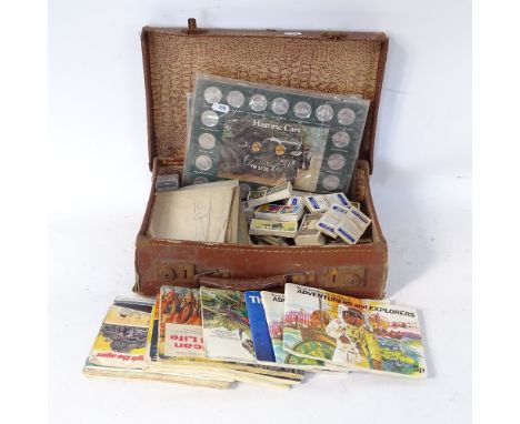 A Vintage leather-covered briefcase, containing various cigarette cards, historic car coins etc 