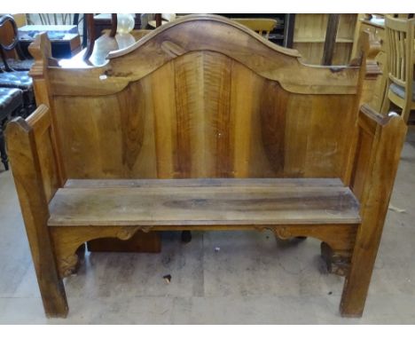 An Antique walnut hall bench, with raised shaped back, W127cm 