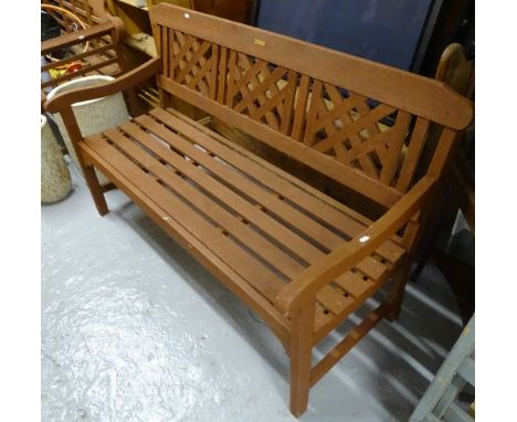 A stained hardwood slatted garden bench, L139cm 