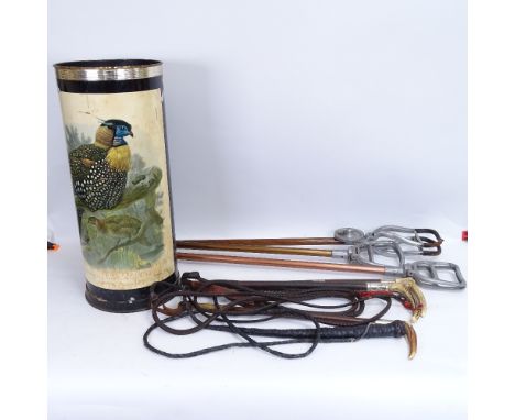 A modern painted and lithographed barrel stick stand, containing 3 horn-handled riding crops and 3 shooting sticks (2 crops h