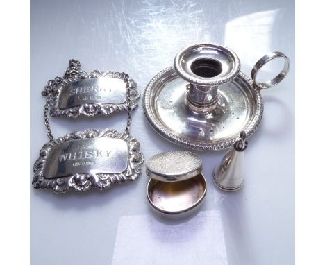 A miniature silver chamber stick and snuffer, a modern oval silver pill pot, and 2 silver decanter labels Whiskey and Sherry,