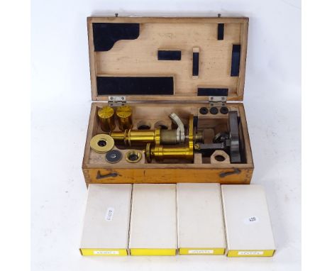 A Carl Zeiss Jena brass microscope and spare lenses, serial no. 22332, cased with various modern microscope slides 