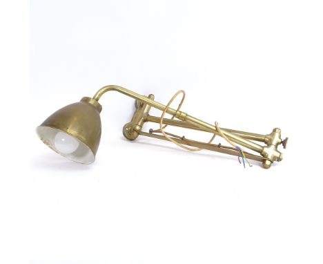 A Victorian brass wall-mounted swivel lamp, enamelled shade, extended arm length 90cm 