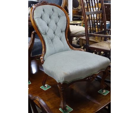 A Victorian walnut-framed and button-back upholstered nursing chair 