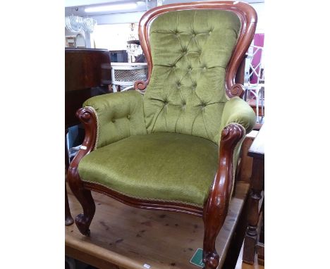 A Victorian mahogany-framed and button-back upholstered armchair 