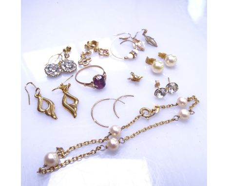 An assorted group of 9ct gold jewellery, mainly to include earrings and a stone set ring, 9.2g gross, and a silver-gilt neckl