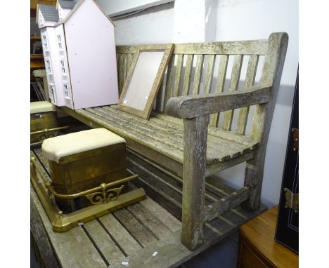 A large weathered hardwood slatted garden bench, L231cm 