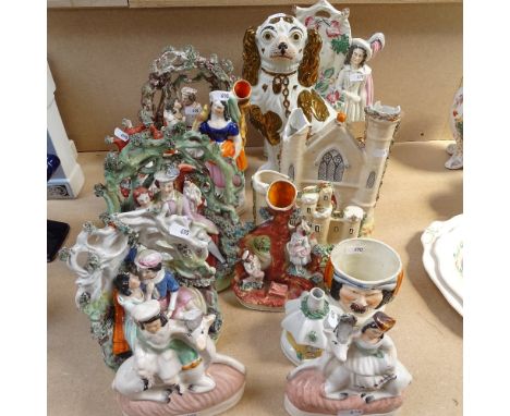 An Edwardian Staffordshire mantel Spaniel 21cm, Victorian and other bocage groups, figures etc 