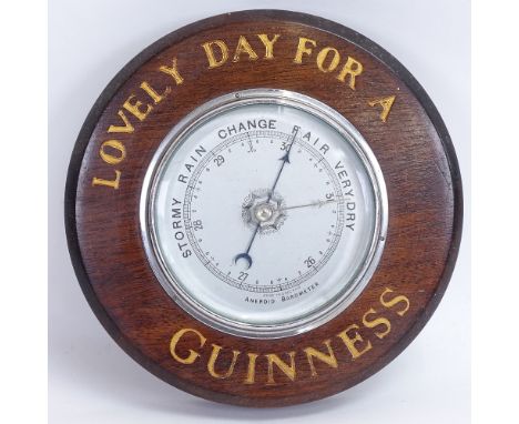 A Vintage Guinness wall hanging mahogany advertising aneroid barometer, diameter 21cm 