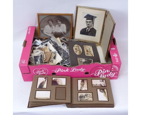 A large quantity of Vintage original family photographs, including an album 