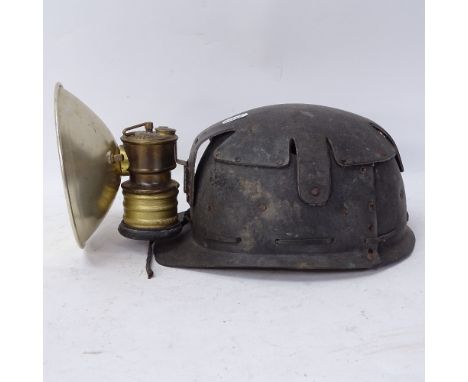 A Vintage plastic Premier miner's helmet lamp 