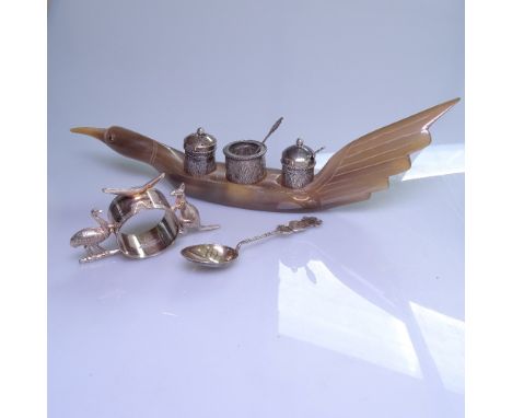 A 3-piece Eastern white metal cruet set on a horn bird design stand, an Australian silver plated napkin ring, and a Chinese s