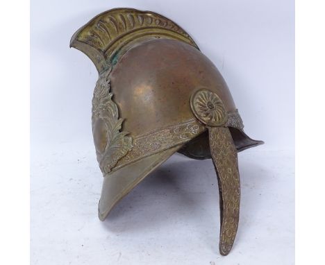 A 19th century French brass fireman's helmet, with badge for SBS Pompiers de Chenerailles 