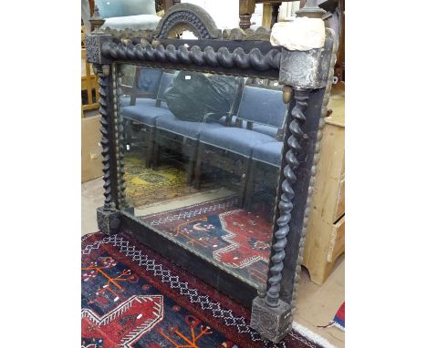 A 19th century stained and gilded over mantel mirror, with applied carved and gilded decoration, gilt acorn mounts and barley
