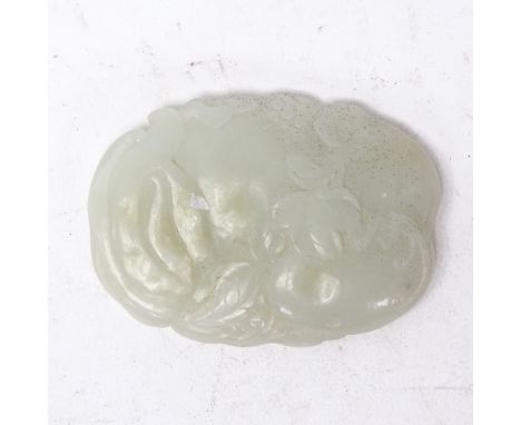 A Chinese carved jade buckle, floral and leaf decoration, length 8cm 