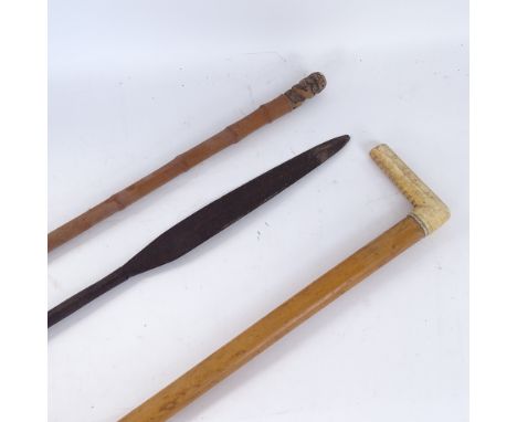 A Tribal hunting spear tip, an Oriental bamboo cane, and an ivory-handled walking stick, longest length 88cm (3) 