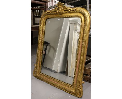 An Antique giltwood and gesso arch-top over mantel mirror, with acanthus leaf pediment, W86cm, H112cm 