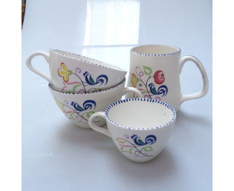 A large quantity of Poole Pottery tea, dinner and coffeeware, with painted floral motifs, including sauce boats and oval plat