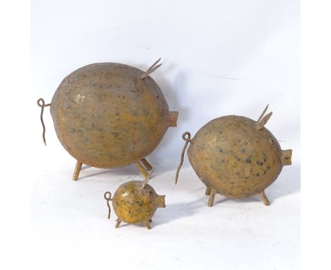 A Vintage set of 3 graduated painted metal pig ornaments, largest height 26cm (3) 