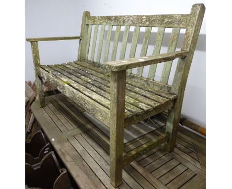 A hardwood slatted and weathered garden bench, W120cm 