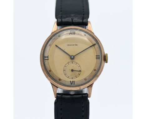 Invicta, a 9ct gold gents manual wind wristwatch.