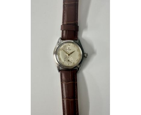 Rolex, a 1946 stainless steel Oyster wristwatch, the dial with arabic gilt numerals, marked Shock Resisting, with sub second 