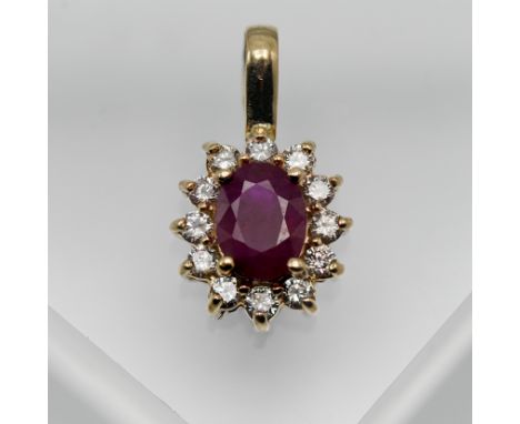 A 14ct yellow gold ruby and diamond pendant.