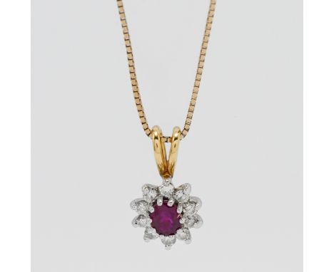 An 18ct yellow gold diamond and ruby pendant on a 9ct gold chain.