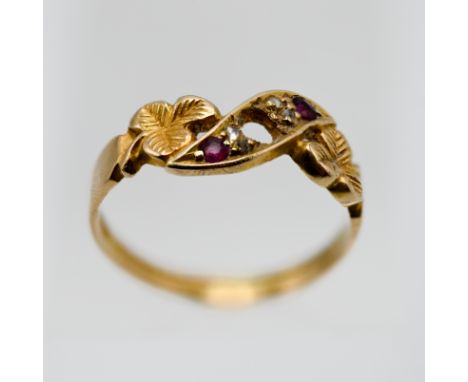 An antique 18ct ruby and diamond ring, with clover leaf design, set in yellow gold, size K.
