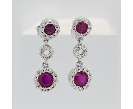 A pair of 18ct white gold diamond and ruby drop earrings.